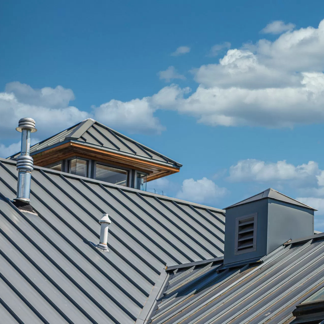 Commercial flat roofing system installed on a large building, showcasing durable materials and professional workmanship.