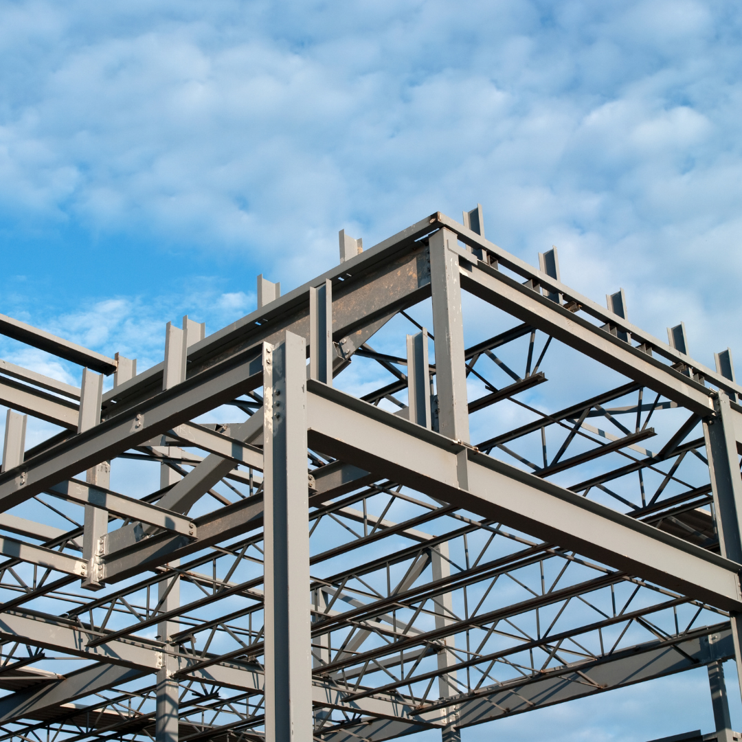 Steel-framed building structure showing durable metal framing used in commercial and agricultural construction projects.
